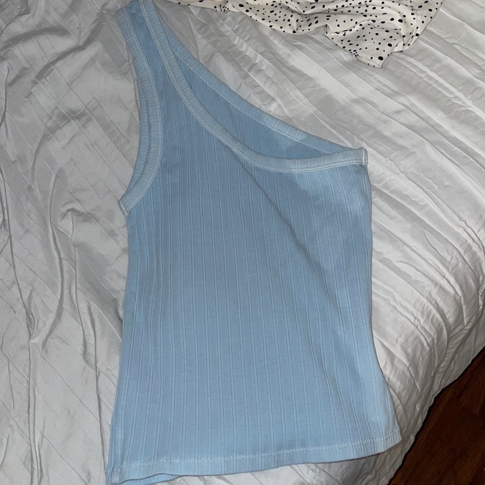 A light blue one strap tank top